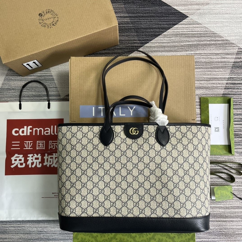 G*u*i shopping bags